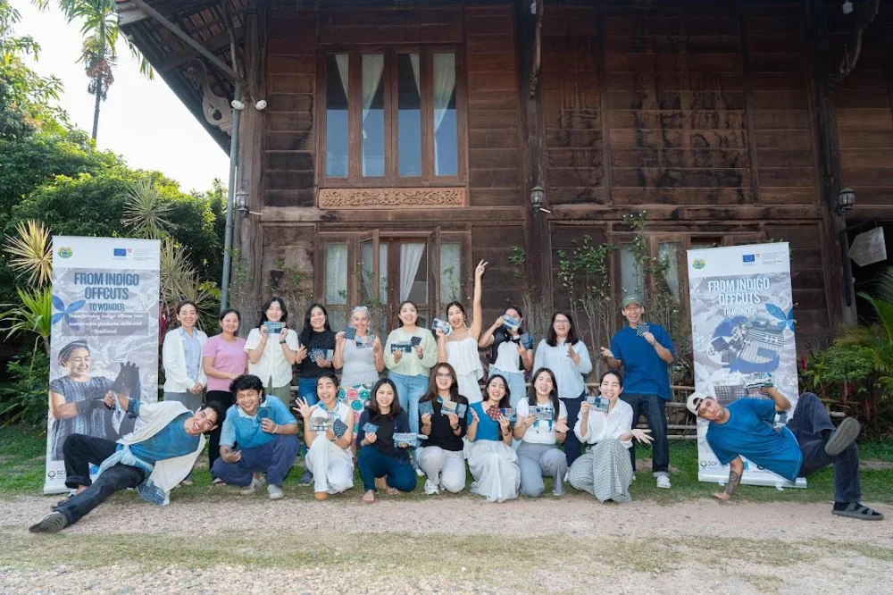 Workshop participants posing with their creations