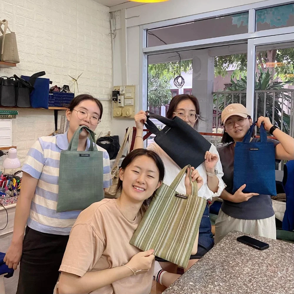 Keep Loudder holding a bag sewing workshop